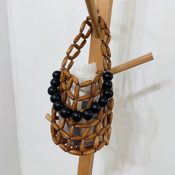 

evening bags hollow woven bag 2023 summer wooden hand woven beach bucket small drawstring bead short handbag purse 230729