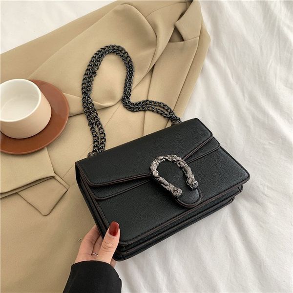 

stylish little square purse with a small flip purse with black chain strap