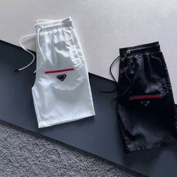 

prad mens shorts triangle letters casual straight five-point casual short beach five-point pants loose clothing, White;black