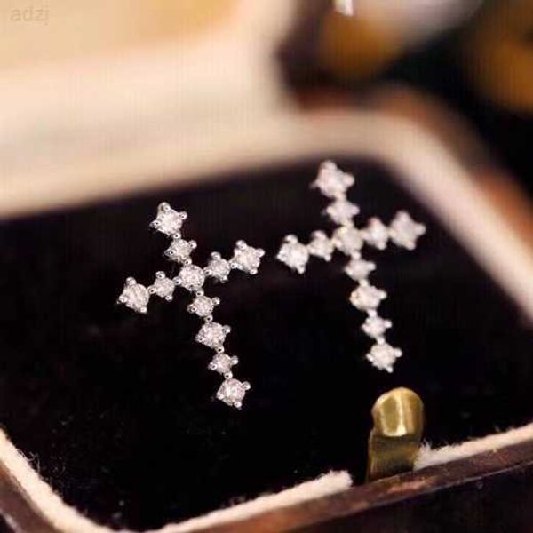 

crafted natural diamond cross earrings in 18k white gold, Golden