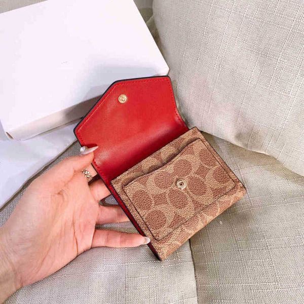 

embossing leather wallets designer bags women designer short printing retro ins student folding buckle zero classic female purses 220328