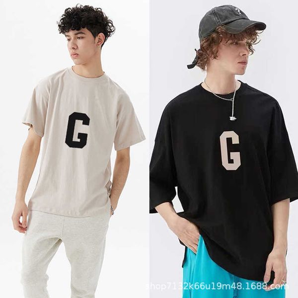 

Fashion ESS Designer T-shirt FOG Season 7 Main Line 7th Flocking Letter G Short Sleeve Cotton High Street Men' and Women' Loose Couple, Black