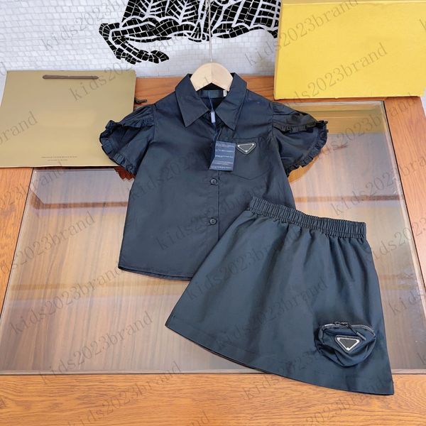 

2023 girls skirts sets brand designer blouse with half skirt two pieces sets ruffled sleeves girls shirts black color short pleated skirts h, White