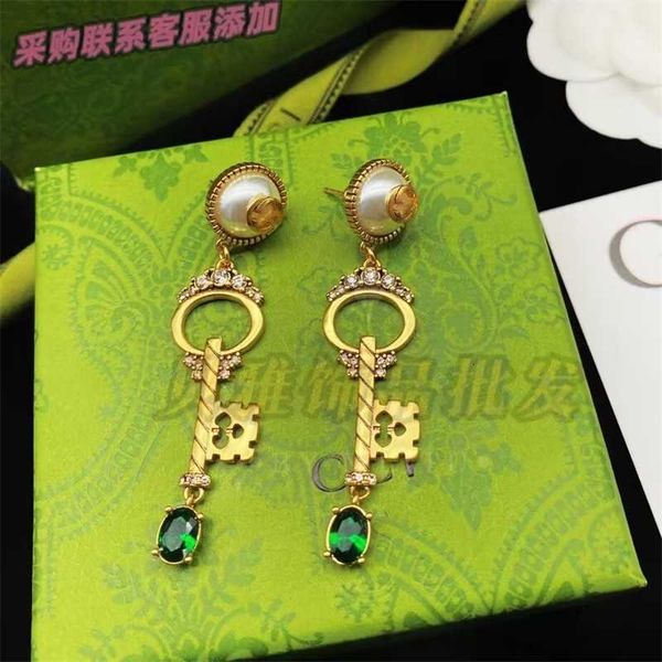 

the same style of gujia double key ear studs hangers emerald pearl rings, Golden