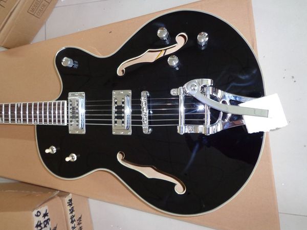 

factory and custom shop black 6120 falcon electric guitar with silver bigbys jazz guitar 69