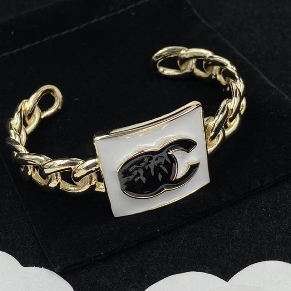 

cuff hollowed out chain with black dripping monogram designer bracelet, White