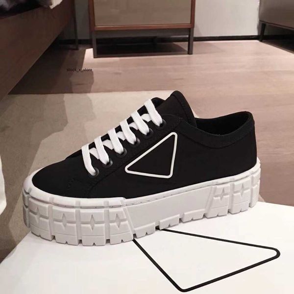 

rubber platform inspired by motocross tires defines the unusual design of these nylon gabardine sneakers, Black
