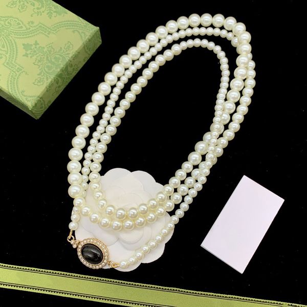 

interlocking lady designer cream glass pearl necklace with vintage logo detail on the clasp woman fashion with three rows of glass pearls of, Silver