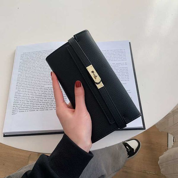

2023 new wallet women's long and korean three fold buckle handbag simple money trend