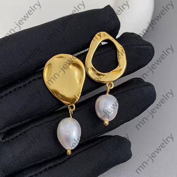 

asymmetric charm earrings. natural baroque pearl earrings female niche design earrings. light luxury advanced earrings gold earrings, Golden