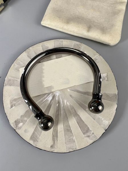 

designer bracelet black jewelry mens fashion versatile strap has a very textured feel on the hand with textures and logos on both sides, Golden;silver