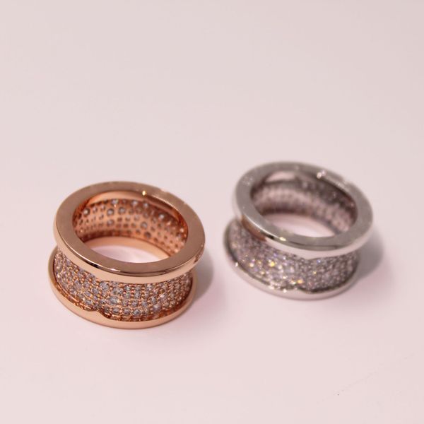 

branded ring with side stones 18k gold filled with diamond and a spring-loaded male fashion jewelry ring., Silver