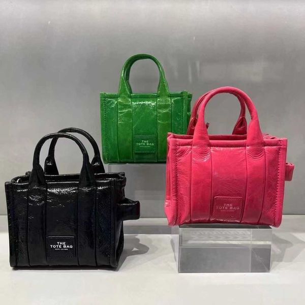 

designer bag 2023 autumn/winter new sheepskin super mini crossbody handbag patent leather glossy candy tote bag