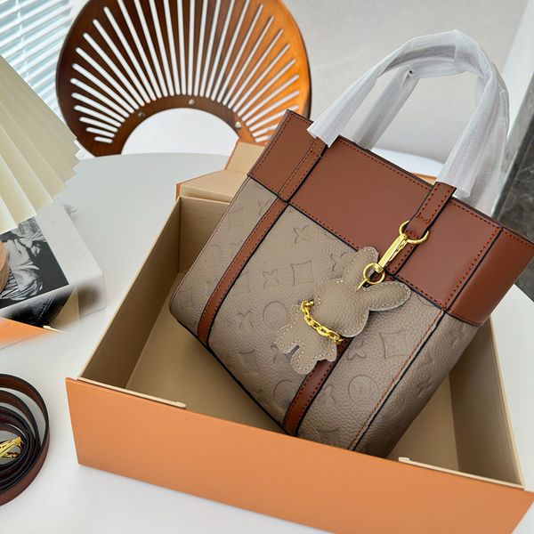 

23ss women luxurys designer two-tone totes bags onthego handbag embossment flowers shouder crossbody ladies handbags sac plat cross with ori