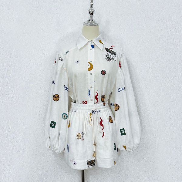

two piece dress australian designer designs a two piece set of pure white linen with childlike embroidery and printed shirts and shorts