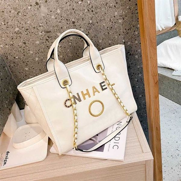 

60% off luxury women's classic handbags beach metal badge tote bag small female capacity large leather one shoulder backpack myst