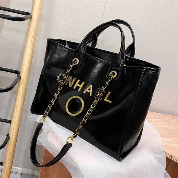 

luxury designer classic handbags women's beach metal badge tote bag small female capacity large leather one shoulder backpack vs9v us o