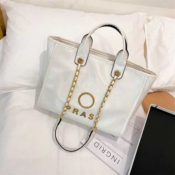 

60% off classic women's handbags beach luxury metal badge tote bag small female capacity large leather one shoulder backpack fy7c