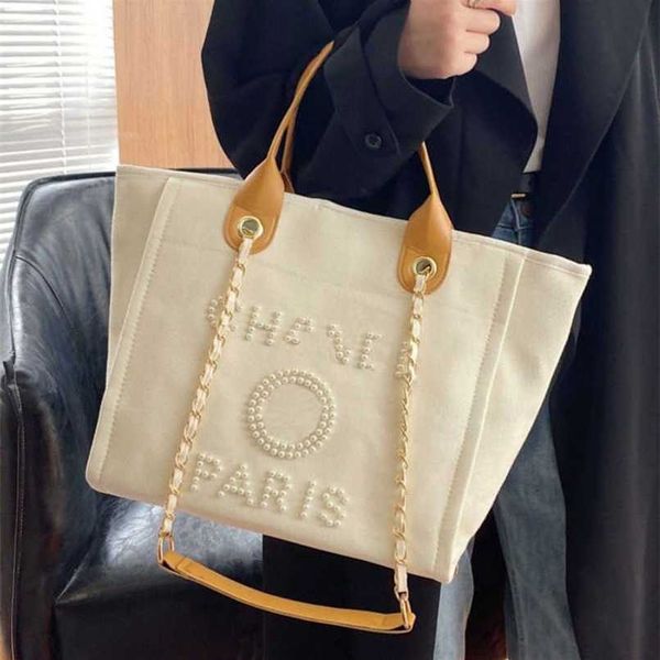 

classic luxury women's beach fashion canvas designers female backpacks large capacity bag small chain packs big shopping handbags 72br