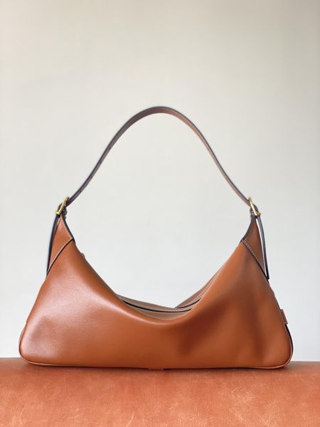 

small grain cowhide with suede lining solid color cowhide precision steel plated thick gold buckle simple size: 34 * 16 * 5 100% calf leathe