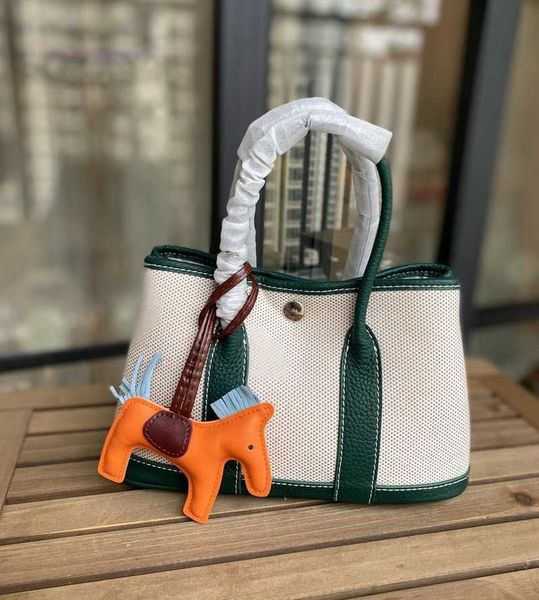 

designer herbag garden party evening 2023 spring new canvas with layer cowhide garden fashion hand color contrast versatile messenger bag h8