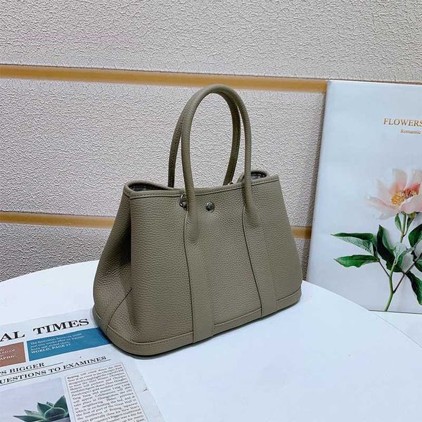 

designer herbag garden party evening garden new layer cowhide fashion versatile one-shoulder hand tote bridal large computer female bag njp3