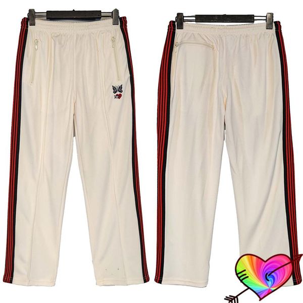 

pants 2022 embroidery heart butterfly awge needles sweatpants men women black red stripe needles pants apricot track trousers