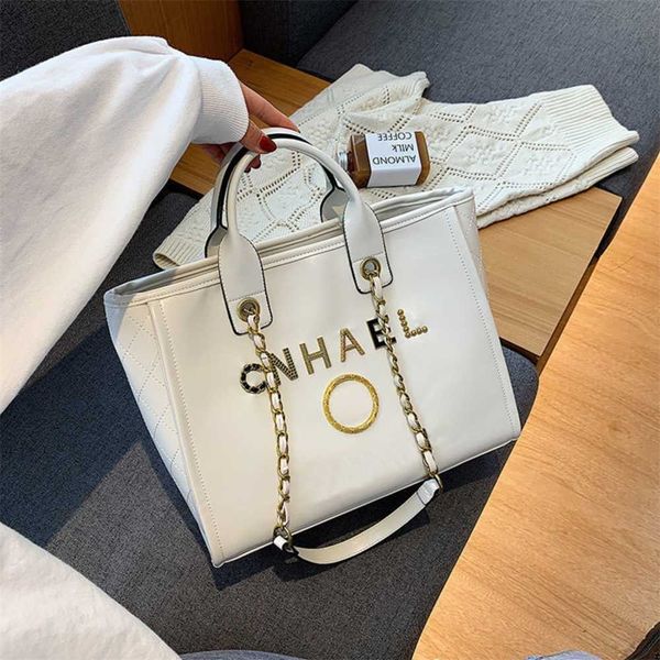 

luxury fashion handbags beach bags brand metal badge tote bag small evening handbag female capacity large leather one shoulder backpack urbe