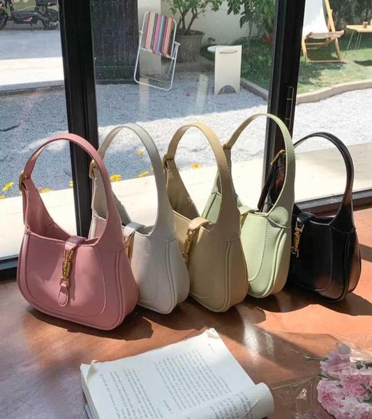 

1961 vintage horse buckle mini french underarm bag for women in spring and summer new texture small portable messenger bag7389886