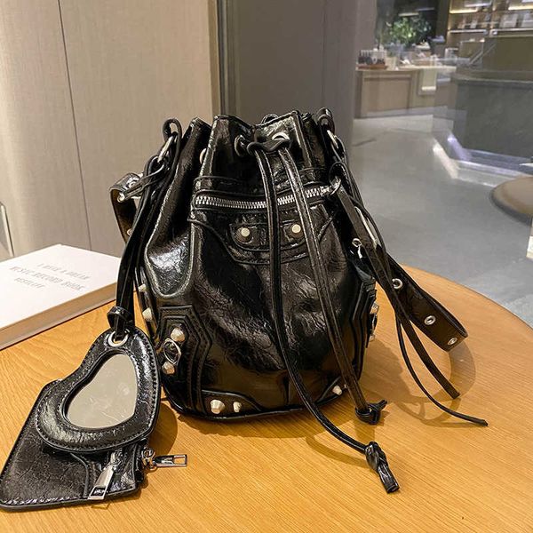 

paris autumn and winter new women's bag rivet motorcycle bag three in one bucket bag fashionable motorcycle shoulder bag