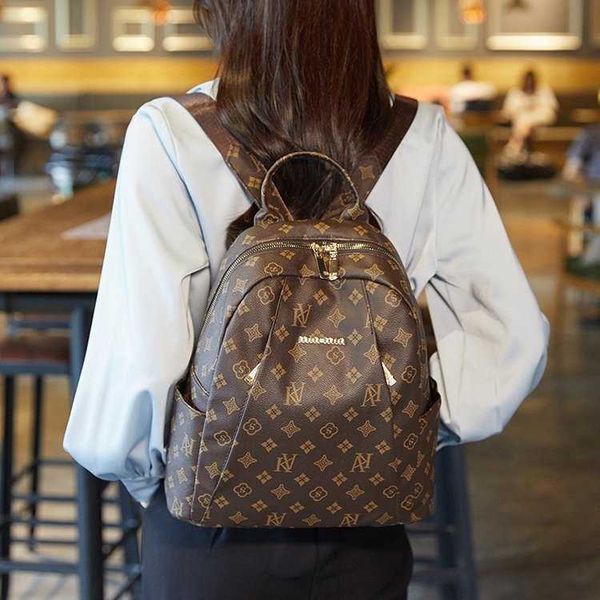 

the new fashion version women's soft leather backpack flower large capacity women's schoolbag