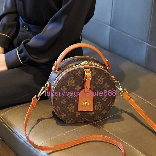 

store bags are sold y female 2023 fashion small round versatile simple brand printed old flower cake single shoulder diagonal cross