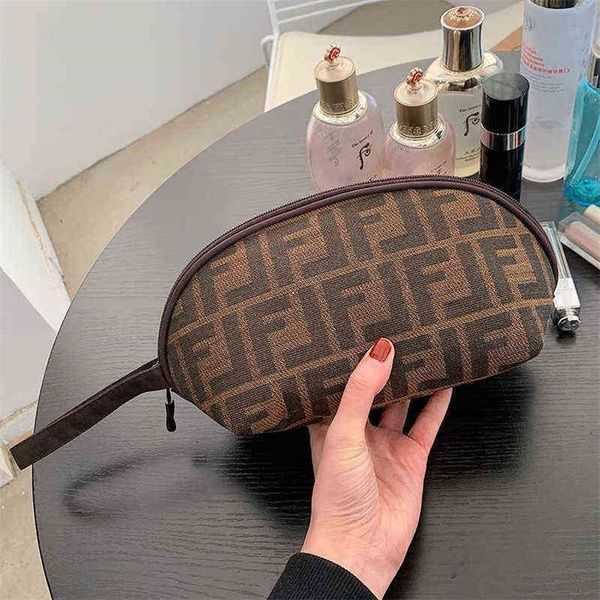 

20% off handbag 2023 new bag travel toiletries women's business trip portable storage large capacity hand holding wallet simple make-up