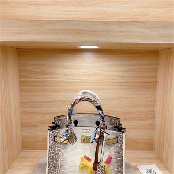 

women birkin herme himalayan bags crocodile print cow leather bag same as classic rich woman holding hands carrying a messenger bag
