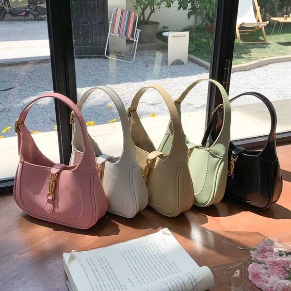 

1961 vintage horse buckle mini french underarm bag for women in spring and summer new texture small portable messenger bag