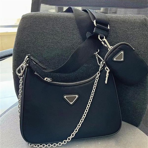 

woman 2005 re-edition triangle nylon crossbody bag luxurs 3 piece 2000 womens mens designer purses satchel with key ring tote chain clu225f