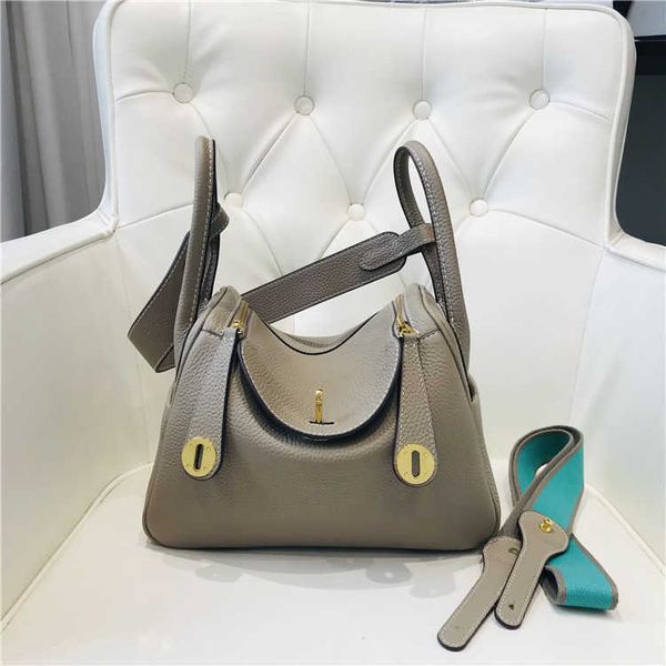 

designer herme lindi bags online outlet bag 2023 new layer cow skin litchi grain women's bag gold buckle m