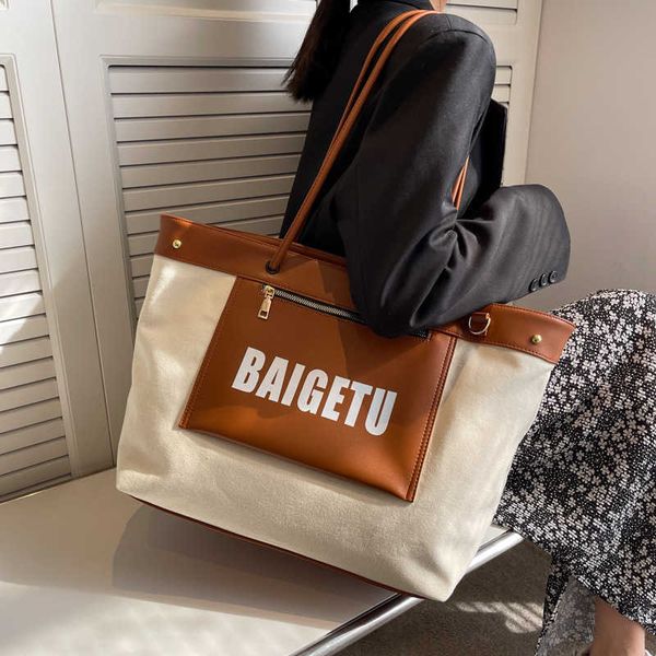 

handbag 2023 hand fashionable new hebei baigou simple canvas fashion printed letter large capacity shoulder bag