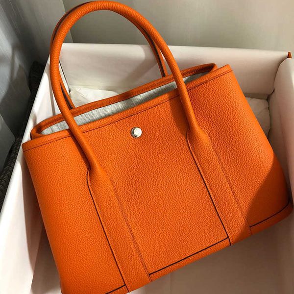 

garden handbags cow leather large capacity bag red bridal handbag hand pull tote with real logo