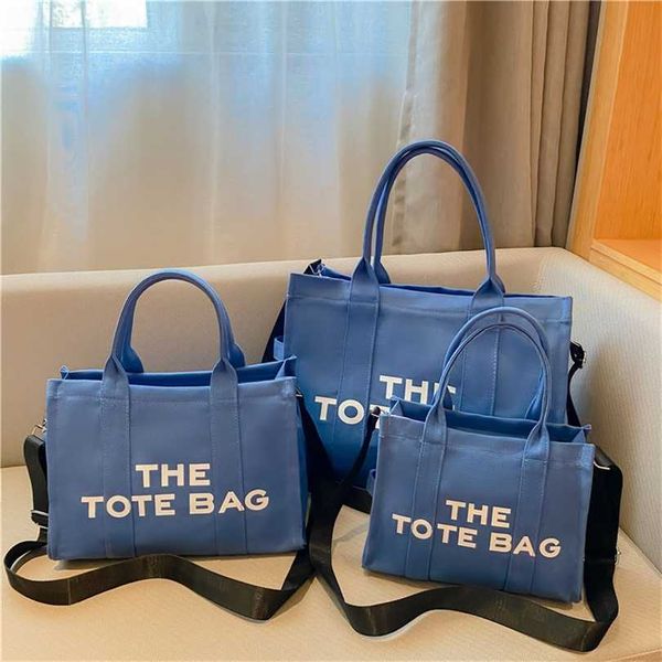 

20% off handbag 2023 handbag fashionable new shoulder bag hebei baigou luggage canvas handheld tote type solid color letter one shoulder cro