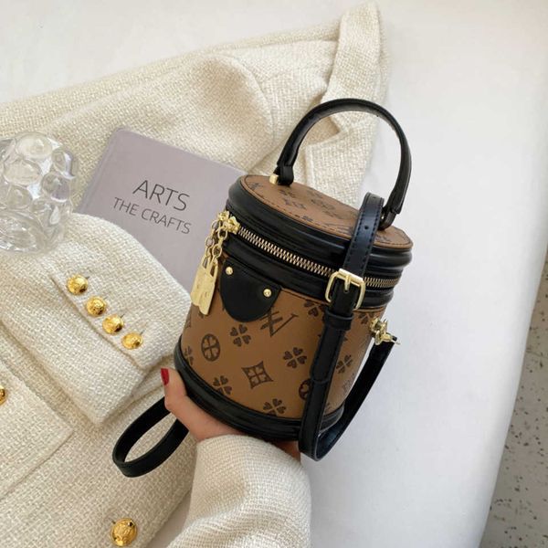 

2023 new shoulder bag bucket spring new hand-held flower small commuting round messenger femalehigh