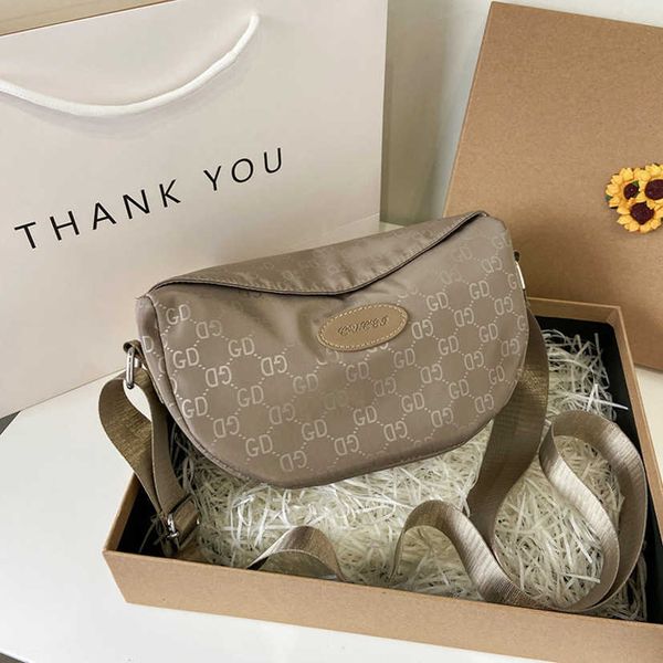 

2023 fashion letters designer bags women's wide single shoulder small women's bag trend canvas cross-body backpack women handbags