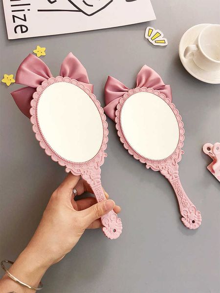

makeup tools gu301 cute bowknot creative handle makeup mirror hand-held beauty salon makeup princess mirror portable mirror pink color j2306