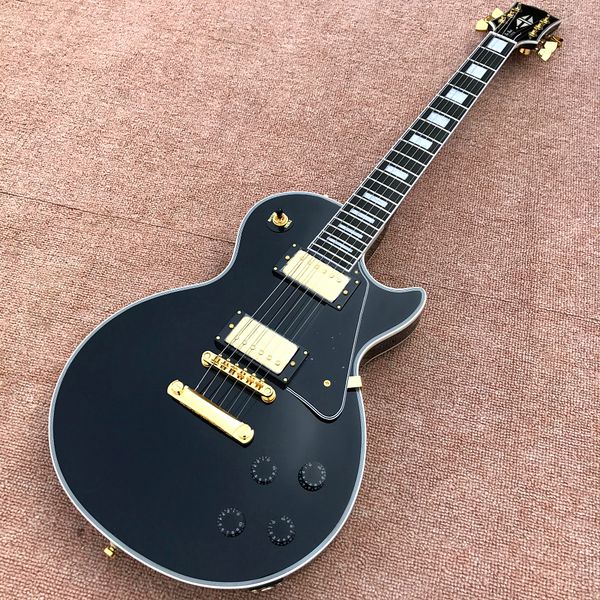 

custom shop, black lp custom electric guitar, gold hardware, ebony bindings, ing