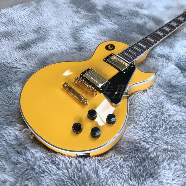 

yellow color electric guitar two pickups with pickguard rose wood fingerboard mahogany wood body