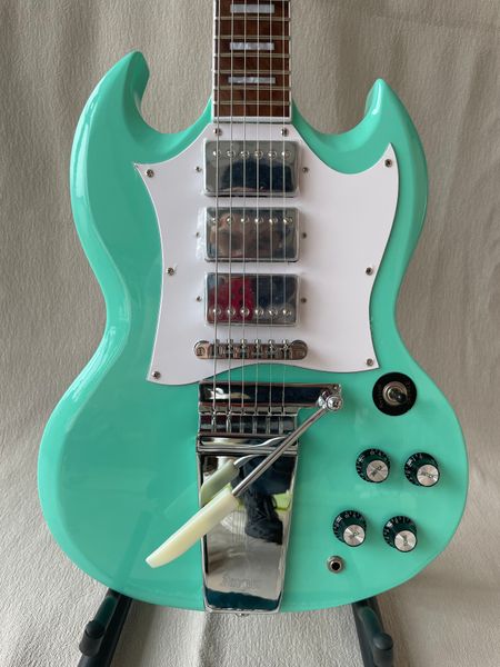 

electric guitar metallic green chrome hardware vibrato system mahogany body rosewood fretboard