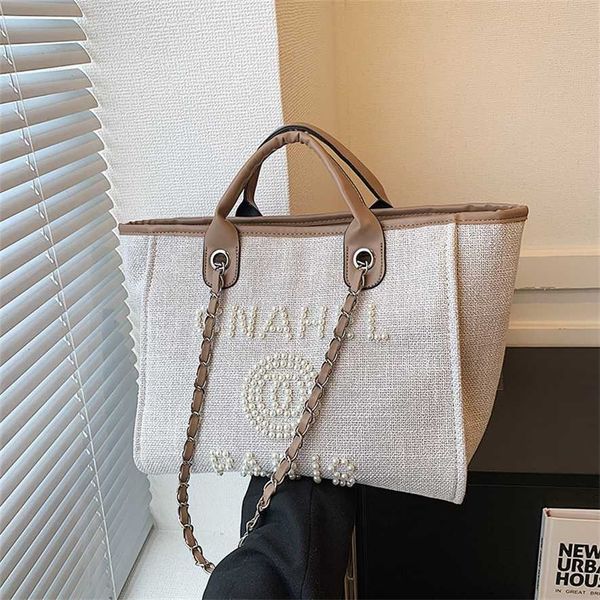 

2023 new little fresh ladies style handbag tote bag pearl beaded letter decorative women's bag ins 75% outlet wholesale