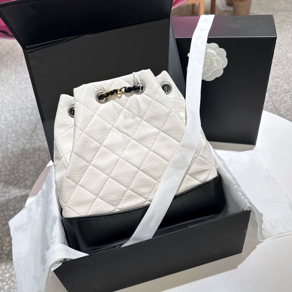 

selling fashion luxury goods in the united states, retro classic cowhide stray backpack, high-quality red lining, gold and silver dual color