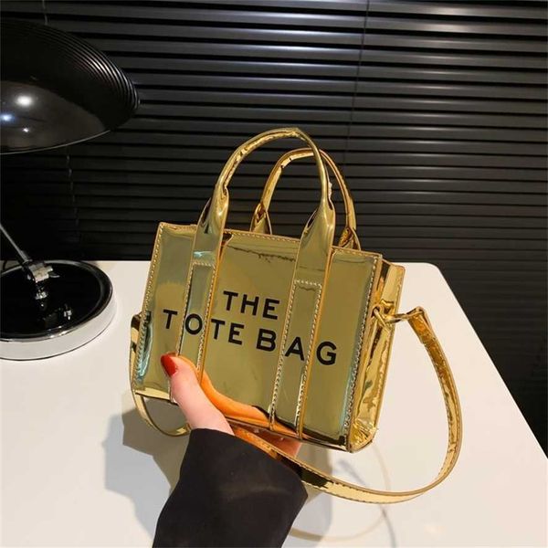 

2023 new bright leather simple tote commuter bag tote bag one shoulder oblique straddle handheld women 75% outlet wholesale
