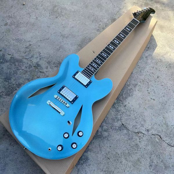 

metallic blue semi-hollow jazz electric guitar, dave grohl 335